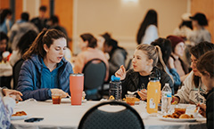 group of girls having lunch at a round table